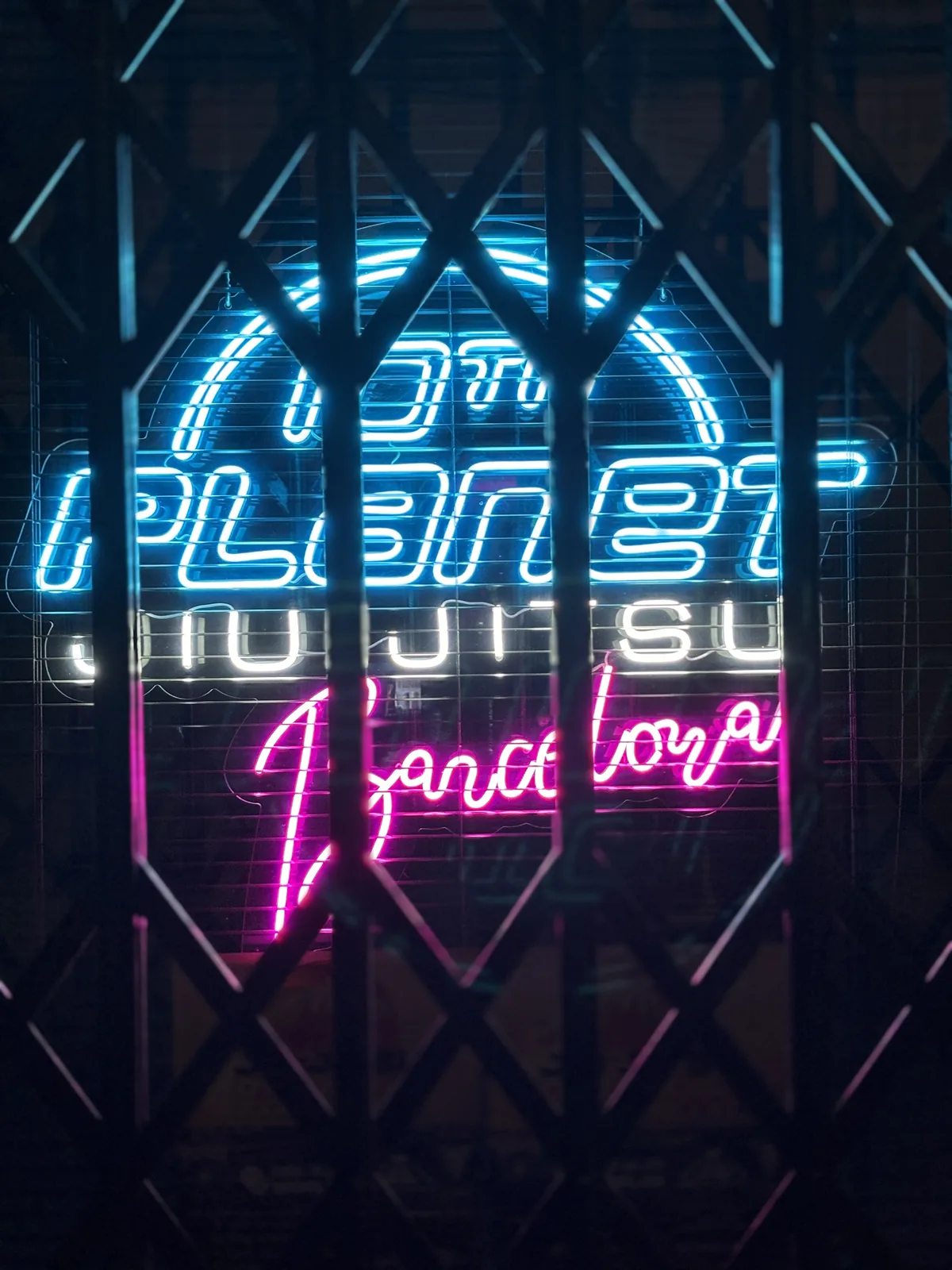 Illuminated entrance of 10th Planet Jiu-Jitsu Barcelona